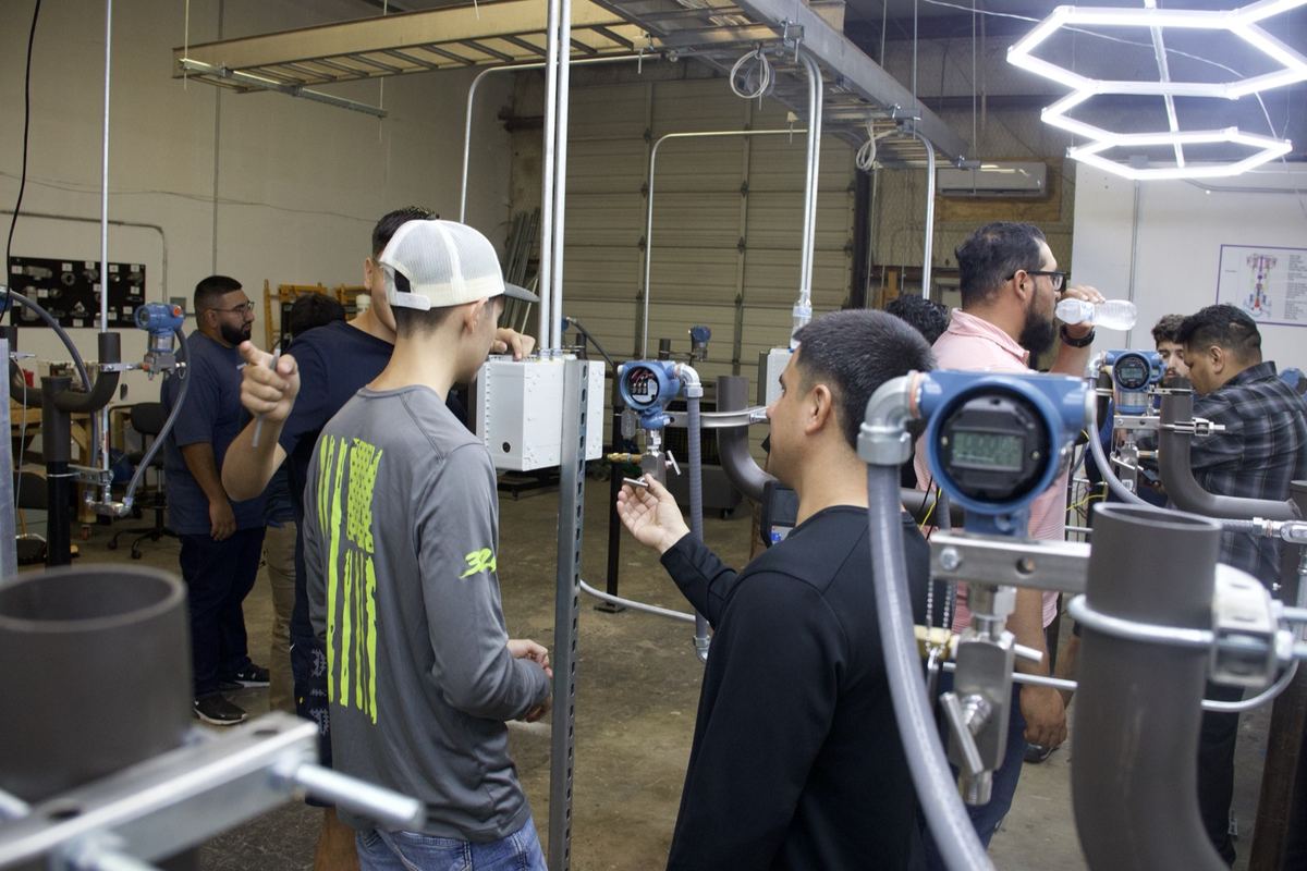 Students training at workstations in the South Texas Trades Academy job site simulator